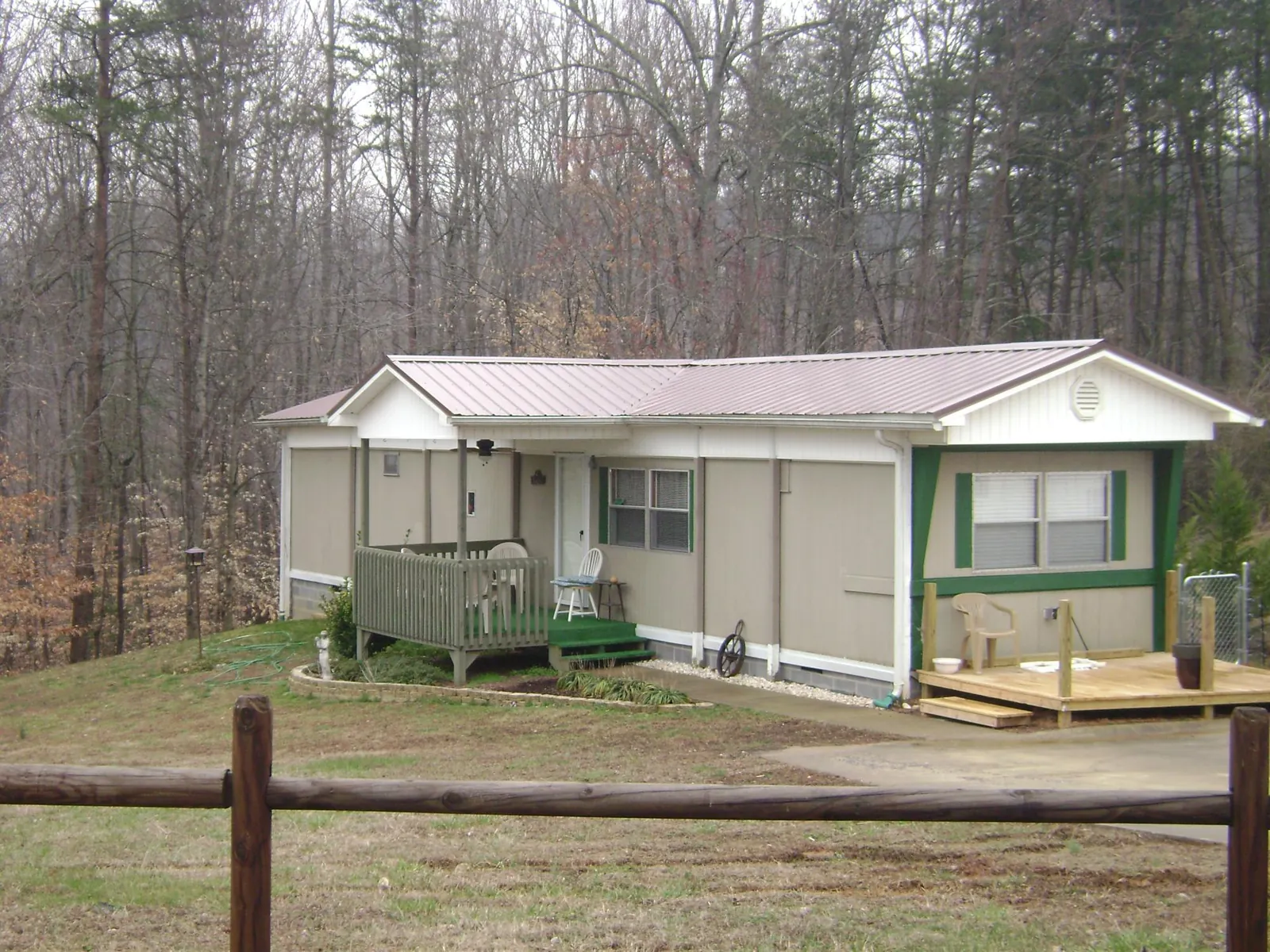 Mauve metal roof on a manufactured home with a new front deck in Woodbridge